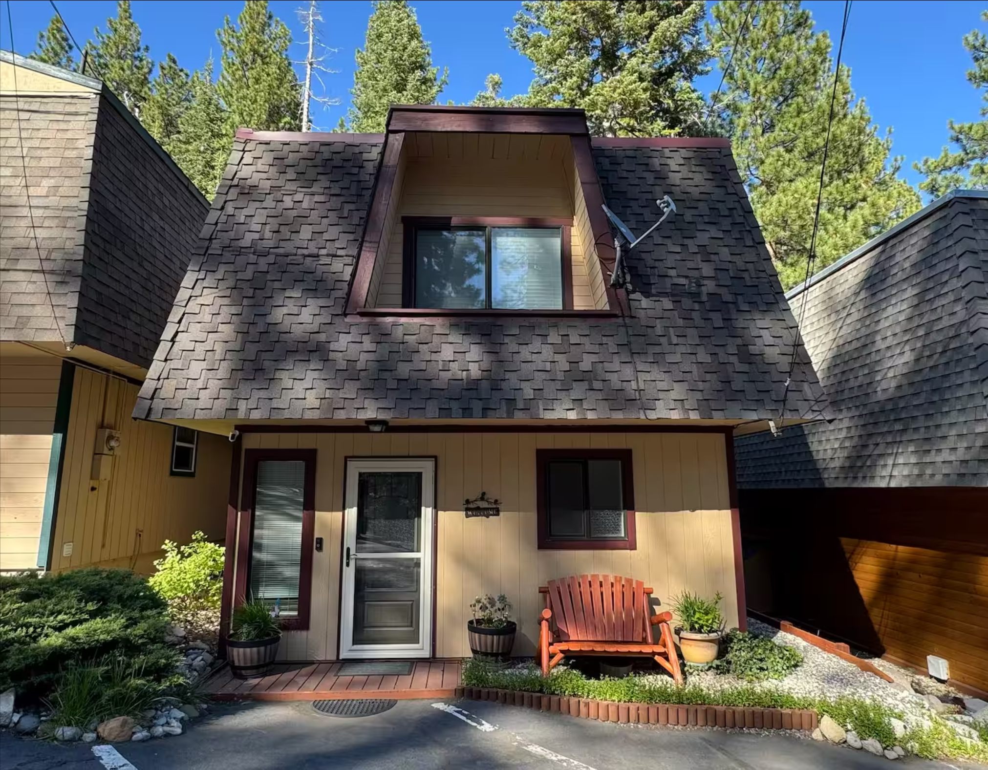 The exterior of our creekside cabin, tucked among the pines and woods